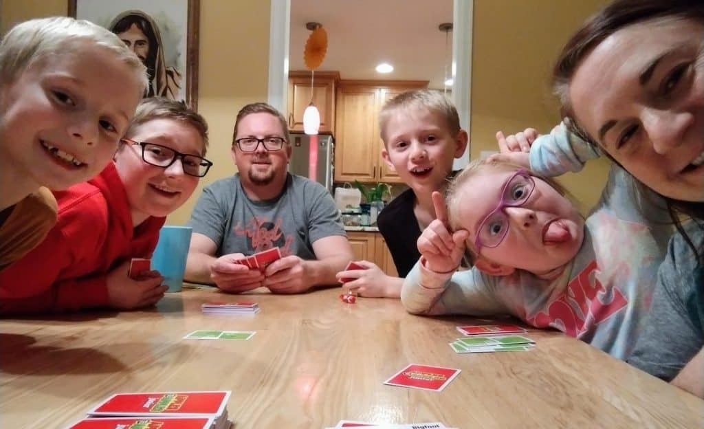 Kim's family enjoying game night.